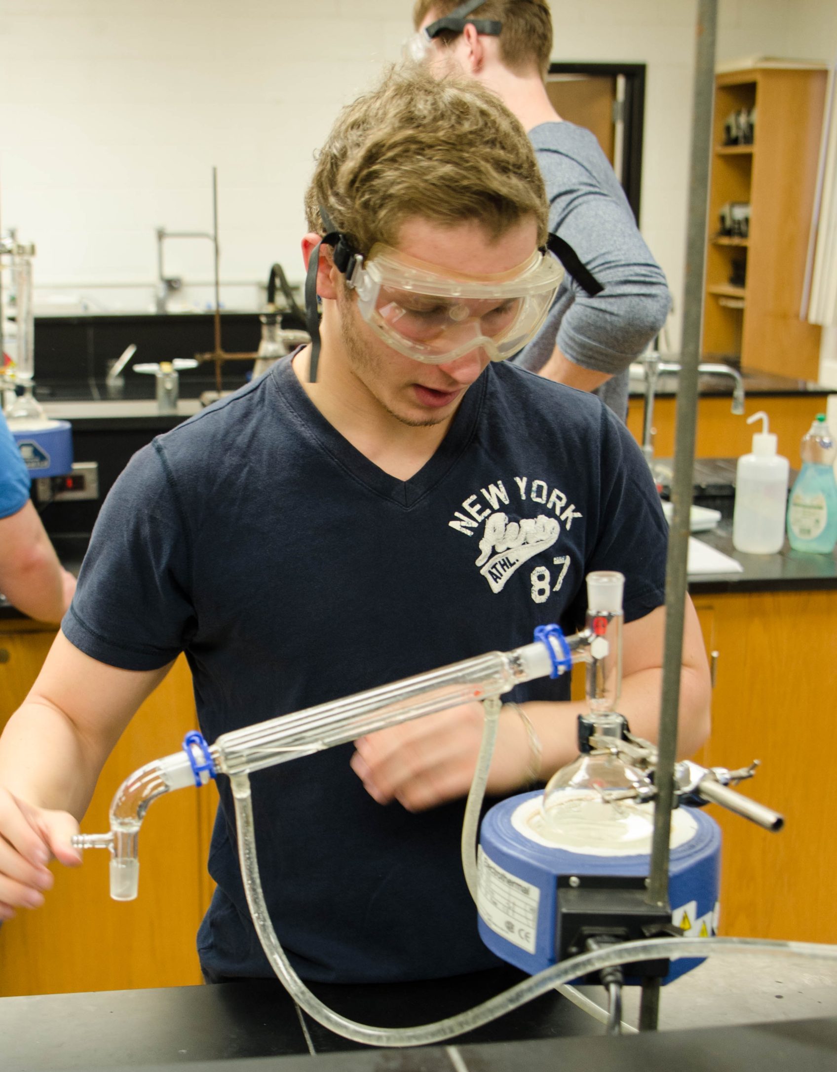one male student in chemistry lab