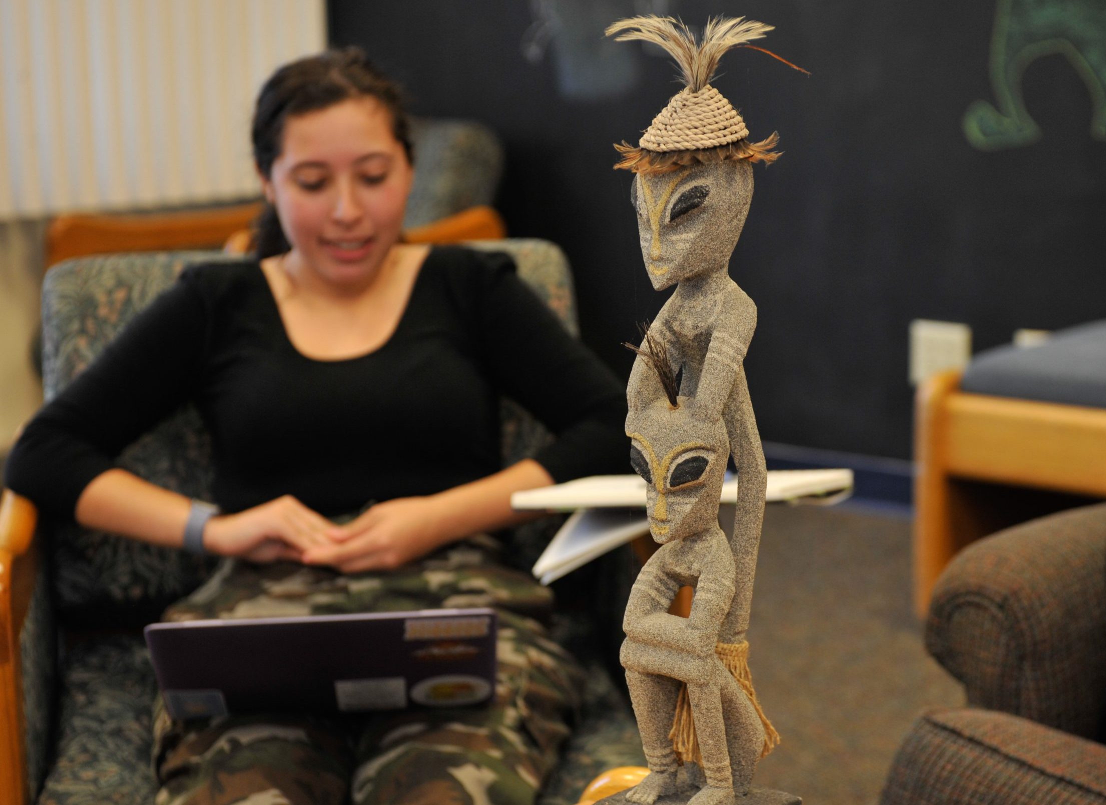 Student describing a statue object during creative writing activity
