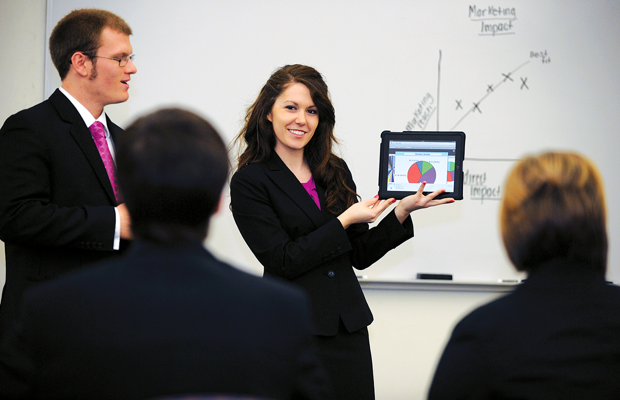 Enactus students showing presentation to other students