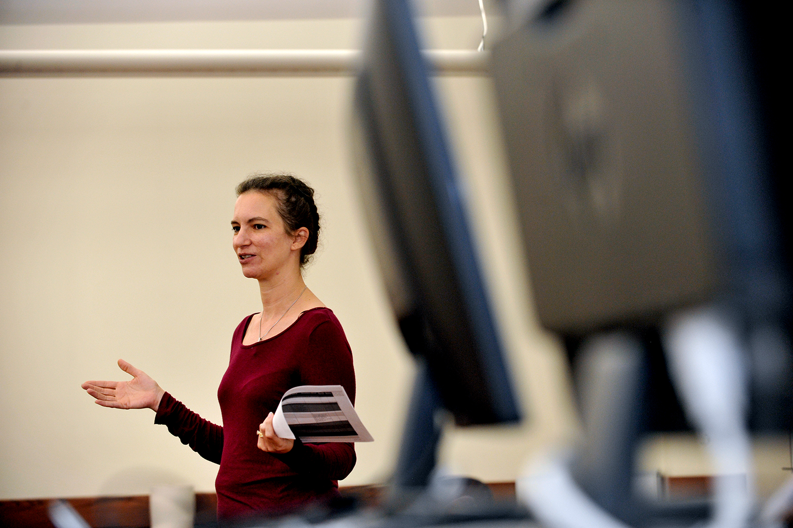 standing female gesturing in computer lab