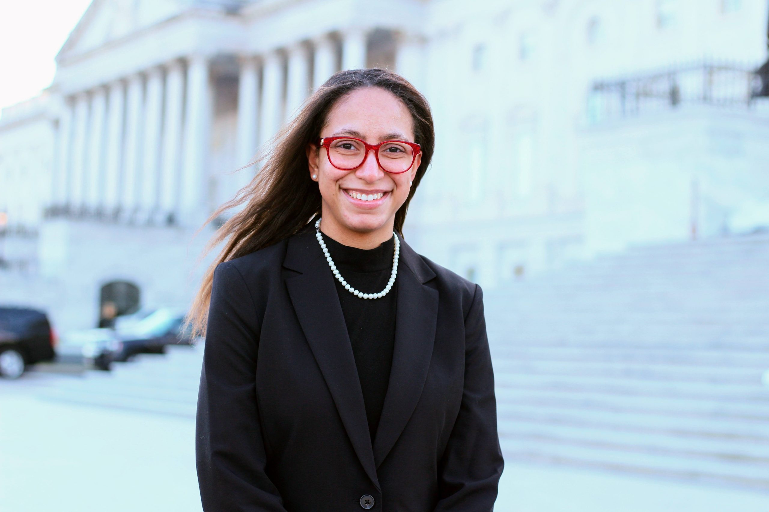 female in front of government building