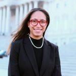 Seneca Ransom in front of pillared building