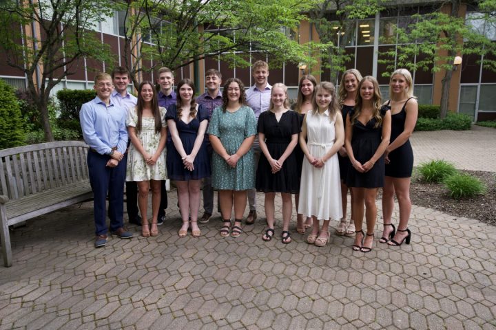 2024 Malone Bachelor of Science in Nursing graduates standing together in the Johnson Center courtyard.