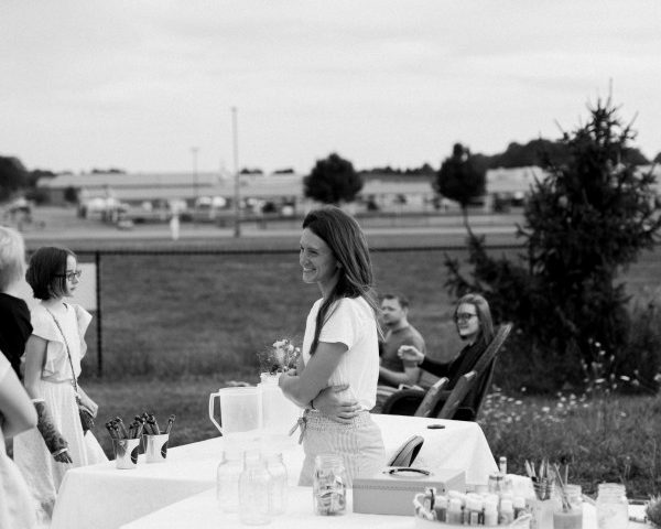 Black and white image of Jillian Humphrey in her wildflower field