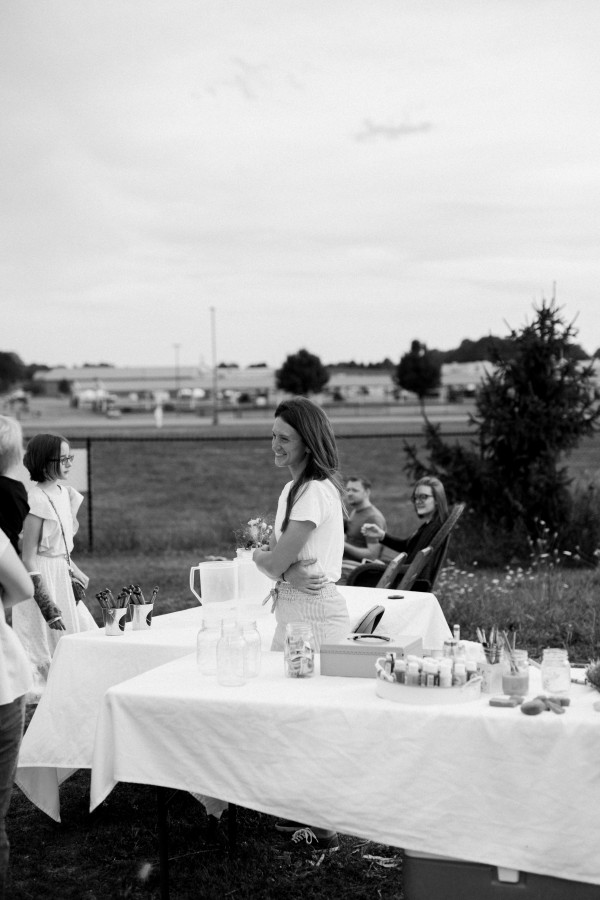 Black and white image of Jillian Humphrey in her wildflower field