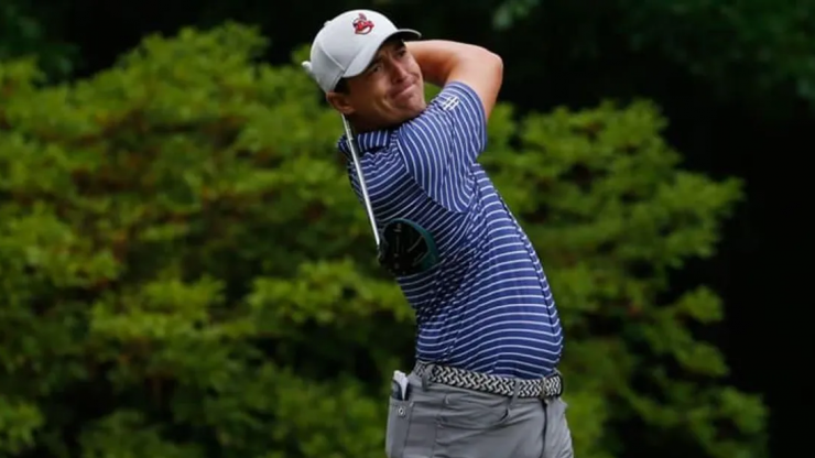 Justin Lower mid swing with his golf club