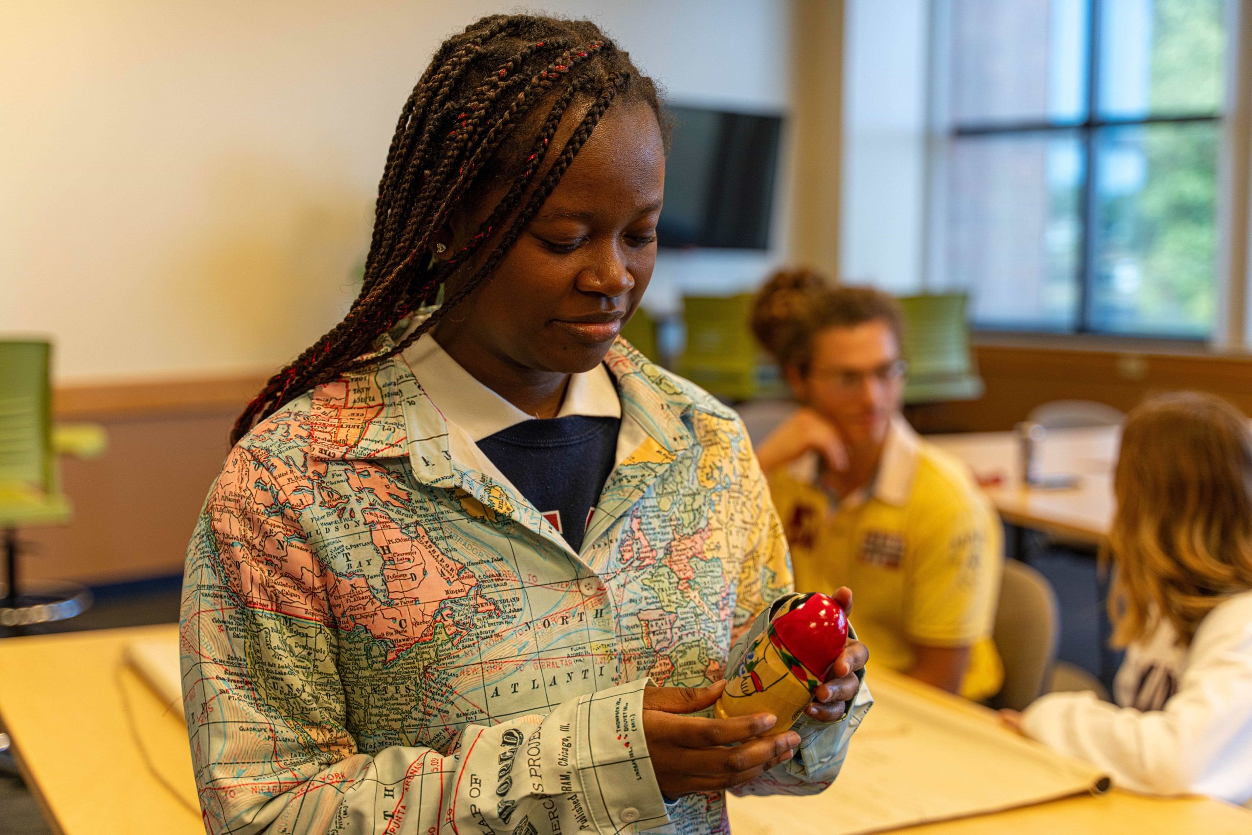 woman holding a stacking doll