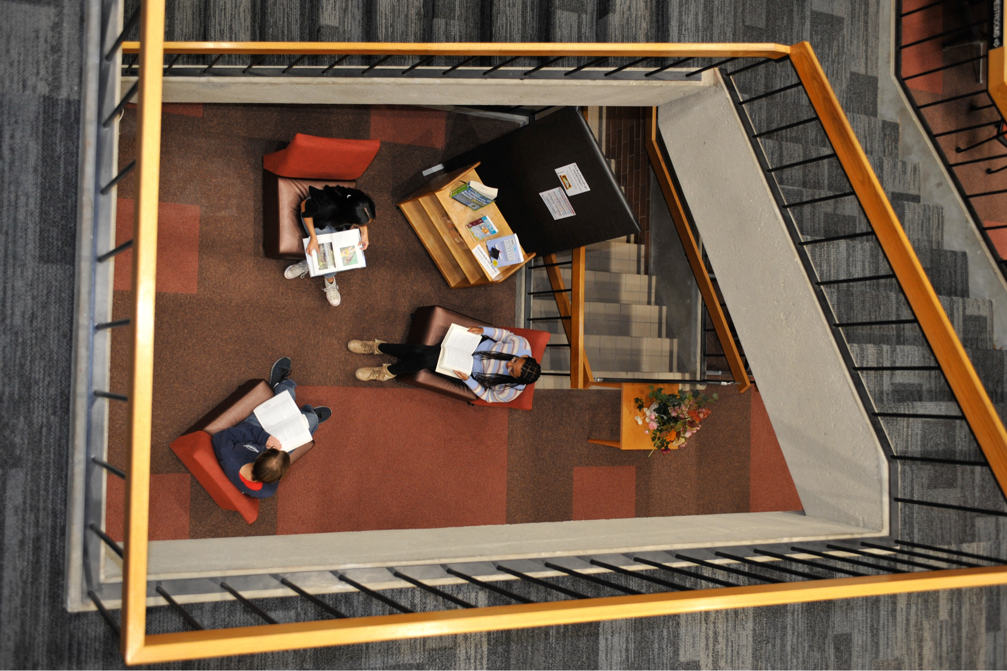 aerial view of a small group of students studying in the Malone library