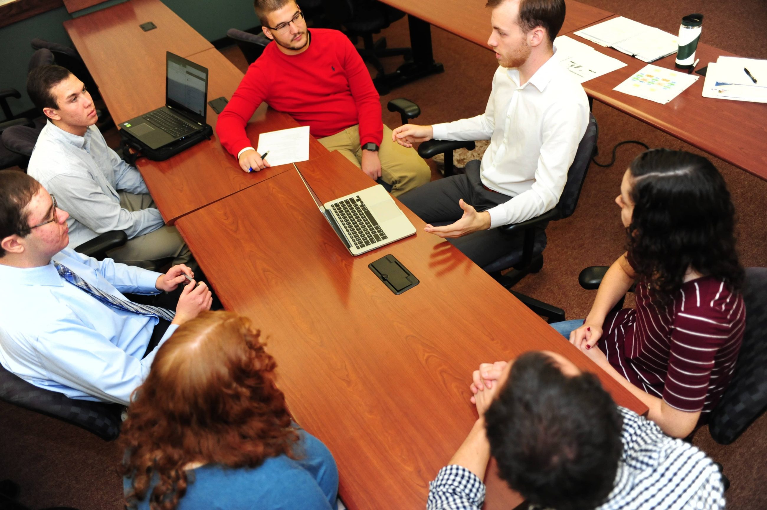 students around table in business classroom