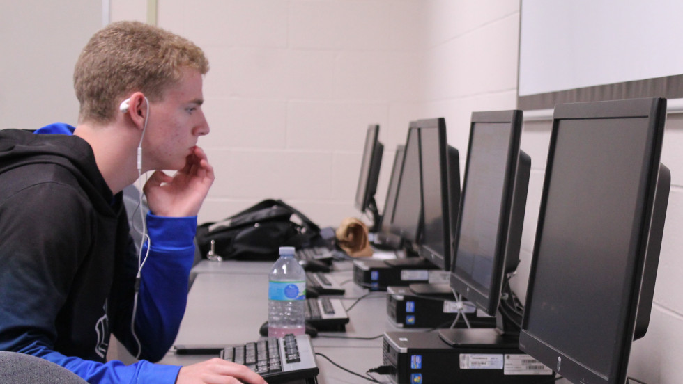 male student in computer lab