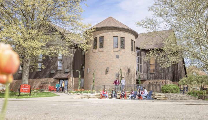 outdoor image of Malone Randall Campus Center with students in front