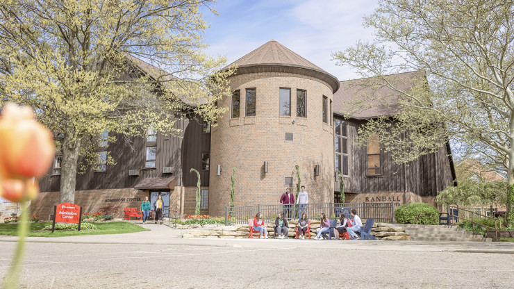 outdoor image of Malone Randall Campus Center with students in front