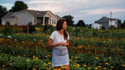Jillian Humphrey in front of field of colorful flowers