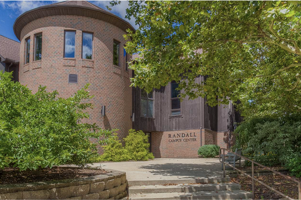 Exterior photo of the Randall campus center brick building and steps