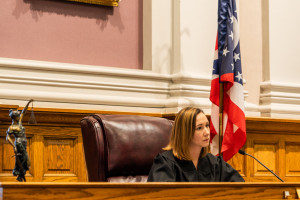 Kristen Moore seated in judge's seat in courtroom