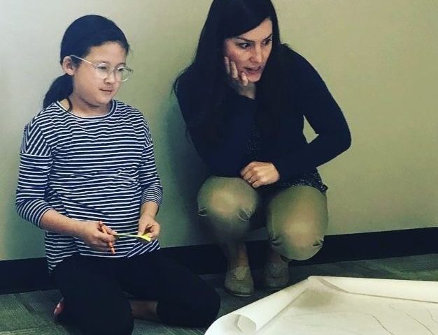 Sarah Keene '09, '15 and young female student