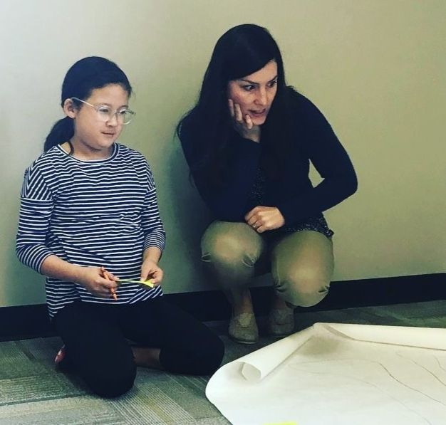 Sarah Keene '09, '15 and young female student